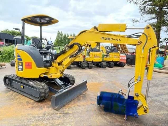 Mini excavator with a Kenki World decal in the Tsukuba yard